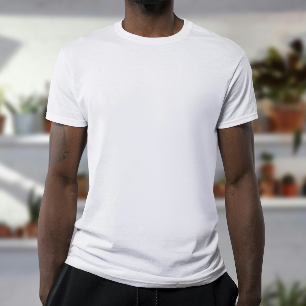 White t-shirt mockup โ logo print coming